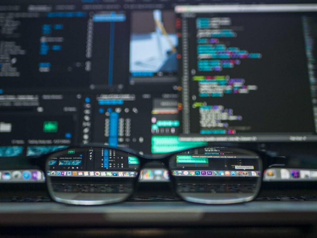 glasses in front of video editing screen